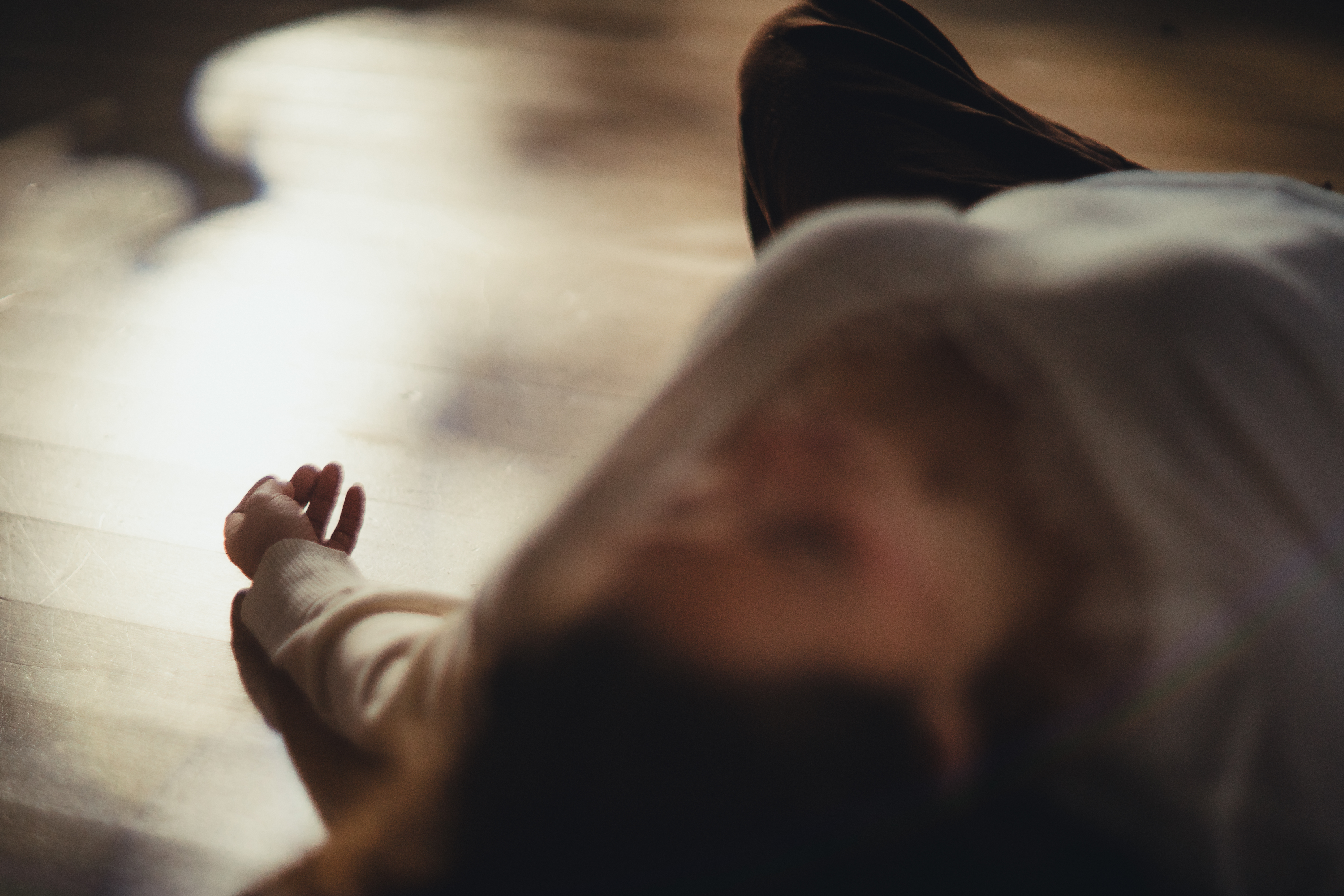 Peaceful resting pose with gentle mudra hand position in soft natural light