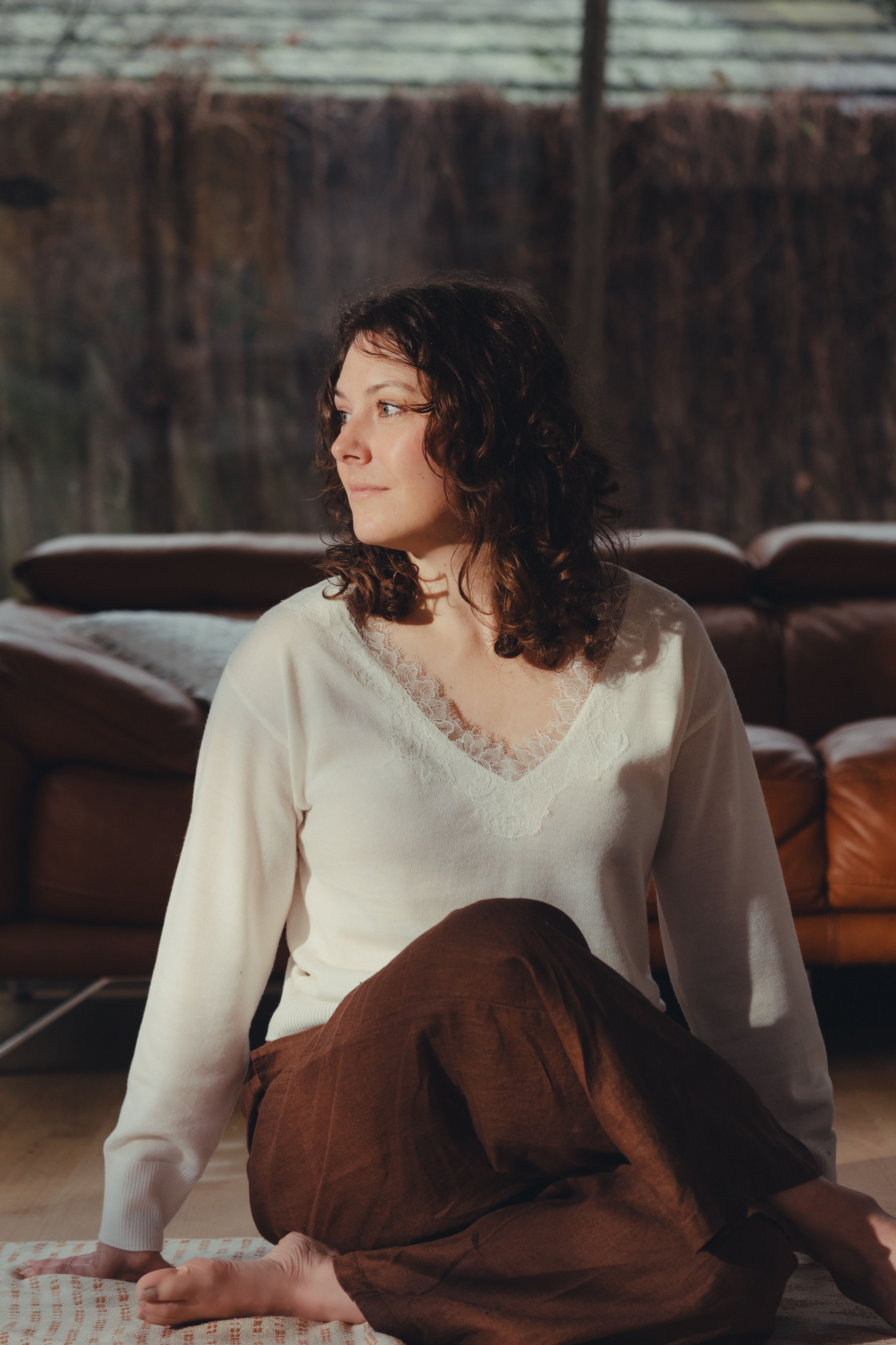 Erin from Beautiful Yoga in a contemplative moment in warm natural light, Blackburn Melbourne