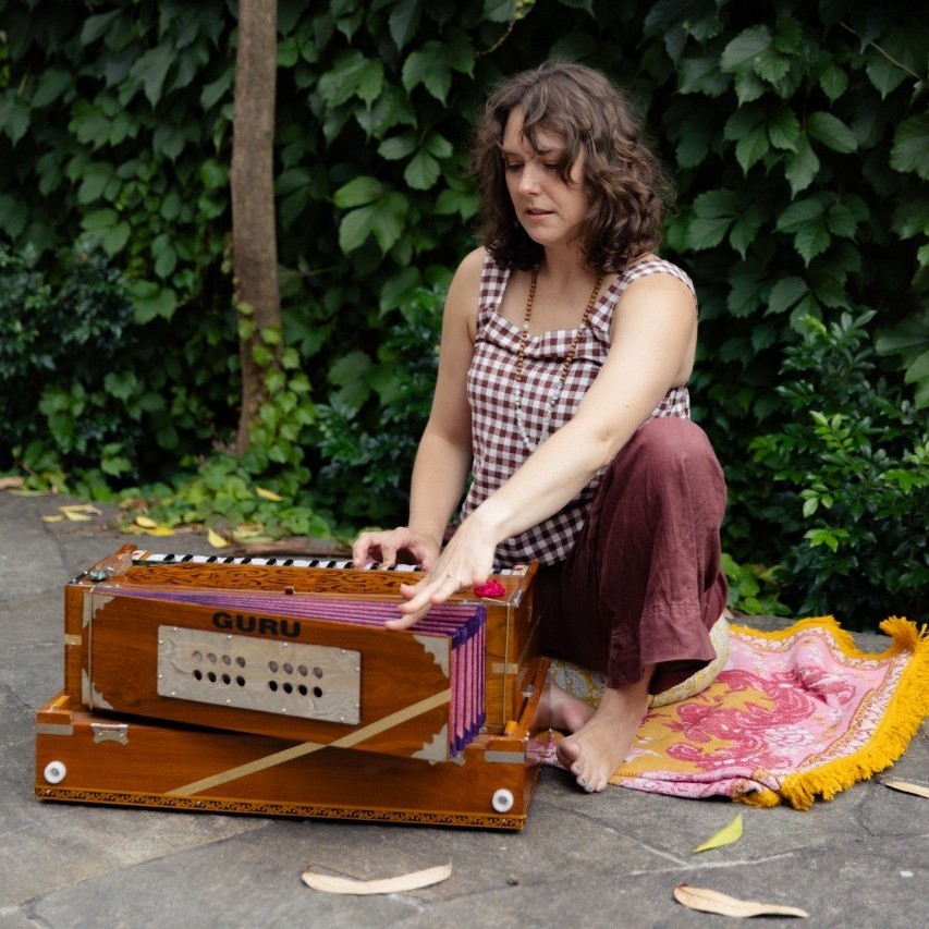Erin playing harmonium in meditation at Beautiful Yoga sound circle in Melbourne