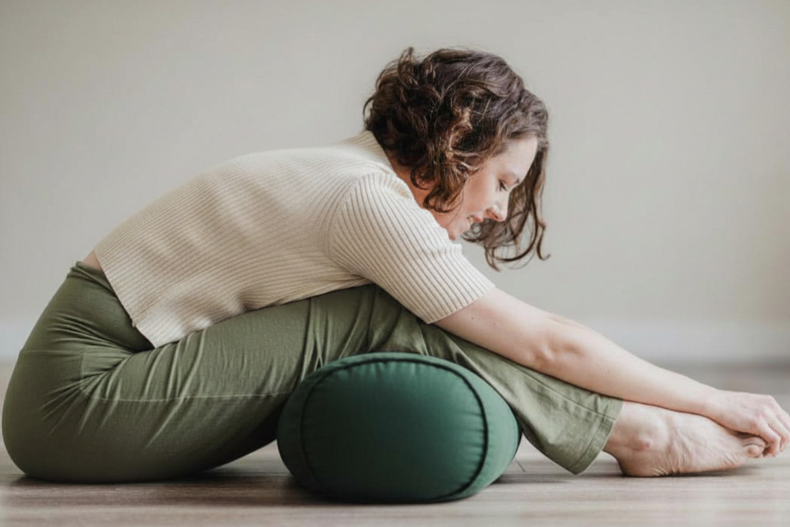 Erin in a gentle supported rest pose for the Rest + Nidra class at Beautiful Yoga